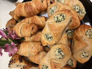 Platter of croissants, danishes and scones